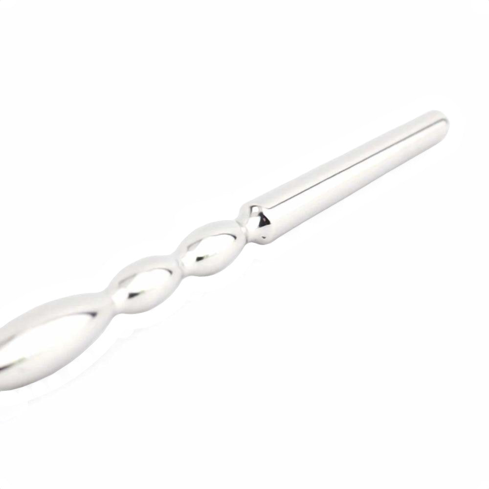 Experience unprecedented urethral pleasure with our wide, smooth, insertable rod. This chastity kit penis plug enhances your sounding cock adventures, featuring a loop handle like a string for safe and easy control. Perfect for both beginners and enthusiasts.