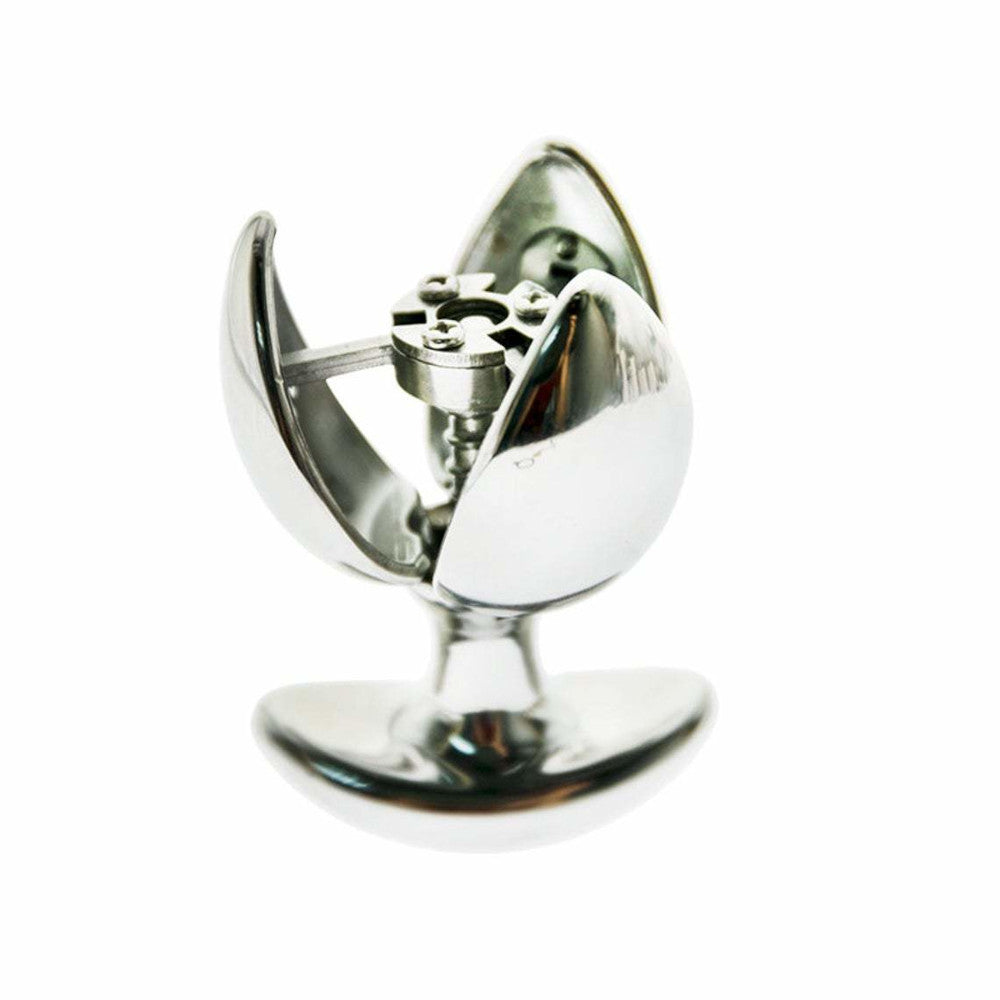 Discover waking desires with this powerful stainless steel chastity butt plug. Slide into exploration behind closed doors with an expandable design fit for bondage queens, leaving no fantasies ended.