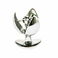 Discover waking desires with this powerful stainless steel chastity butt plug. Slide into exploration behind closed doors with an expandable design fit for bondage queens, leaving no fantasies ended.